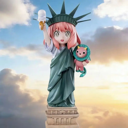 Spy x family anya forger pvc statue featuring pink-haired anya in teal robe with statue of liberty crown holding ice cream and plush