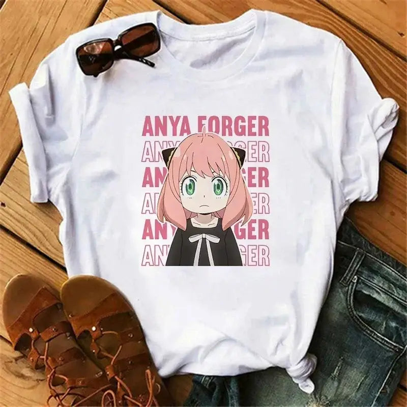 White cotton spy x family t-shirt featuring anya forger with pink hair and repeating anya forger text in pink