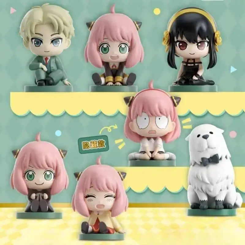 Chibi spy x family anya sitting blind box pvc figures with pink hair black hair and white fluffy dog on green bases