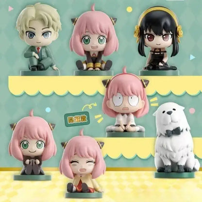 Chibi spy x family anya sitting blind box pvc figures with pink hair black hair and white fluffy dog on green bases