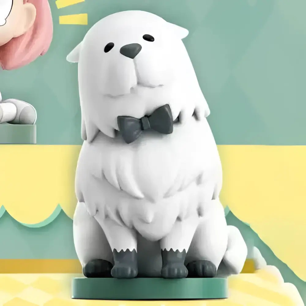 White fluffy dog figurine with black bow tie and gray paws on green base from spy x family anya sitting blind box