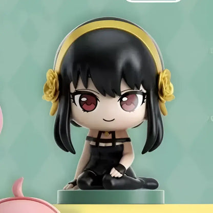 Chibi style family anya sitting blind box figure with black hair red eyes yellow headband in spy x family desktop pvc doll