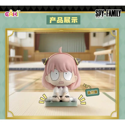Pink-haired spy x family anya sitting blind box figure with black cat ears and white uniform on green pvc base