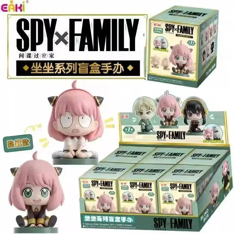 Spy x family anya sitting blind box figure with pink hair and cat ears wide eyes surprised expression desktop pvc doll