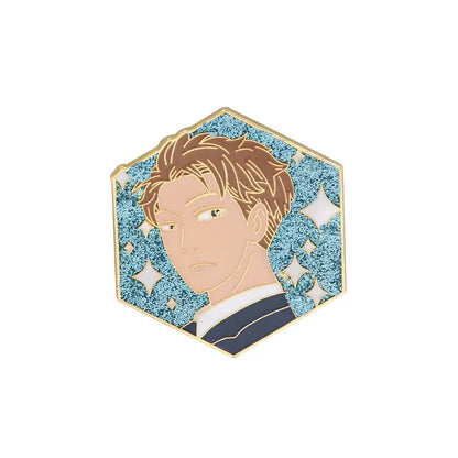 Hexagonal enamel pin of spy x family yor forger featuring anime male portrait with brown hair on glittery blue background