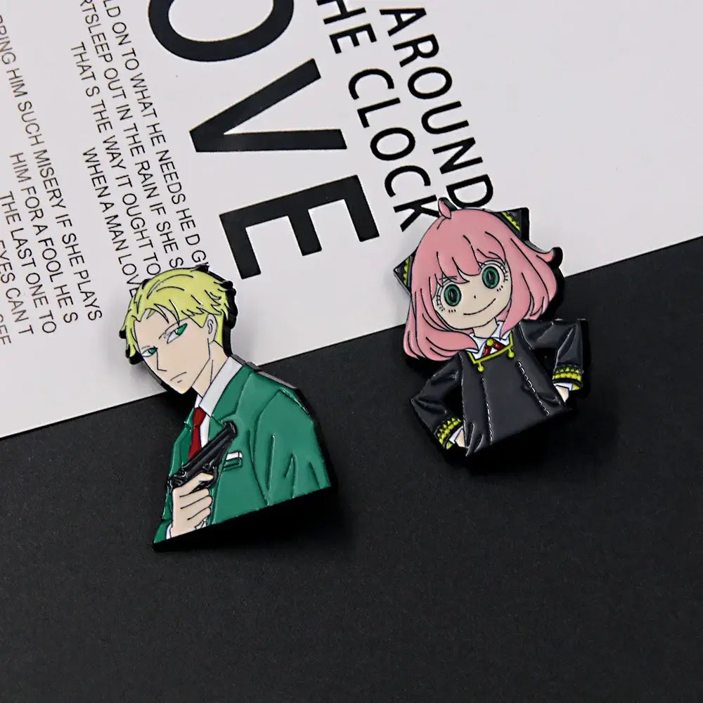 Two enamel spy x family metal badge pins featuring yor forger in green suit and pink hair in black uniform alloy brooch