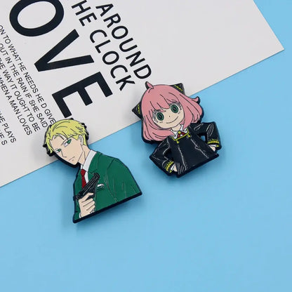 Two enamel metal badge pins featuring spy x family yor forger with blonde hair and pink hair characters in alloy brooch