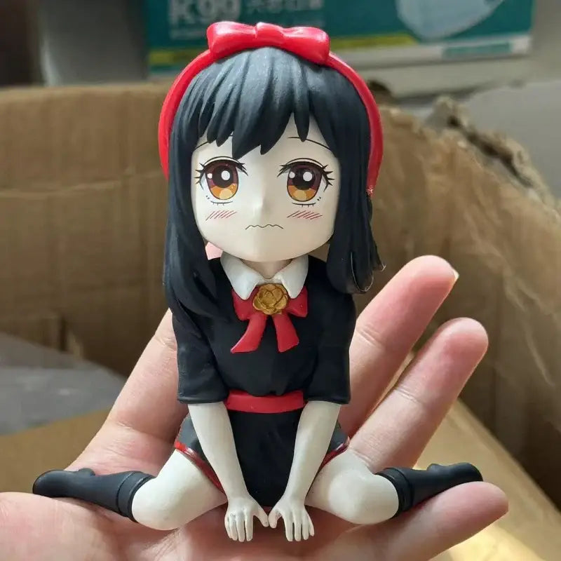 Spy x family yor forger pvc figurine with glossy black and red finish, red bow, gold brooch, and detailed facial expression
