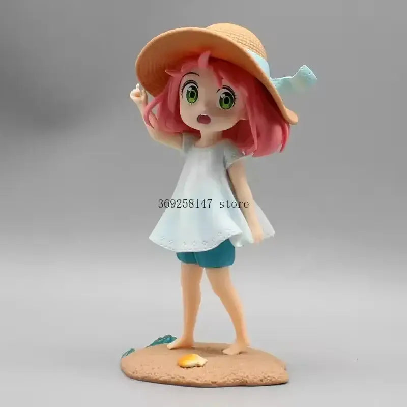 Spy x family yor forger pvc figurine with pink hair and straw hat wearing white top and teal shorts on sandy base
