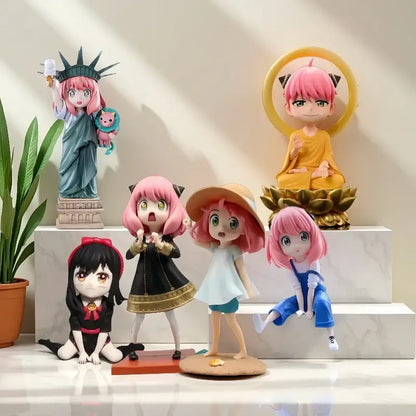Pink-haired spy x family yor forger pvc figurines in various outfits including statue of liberty with cat companion
