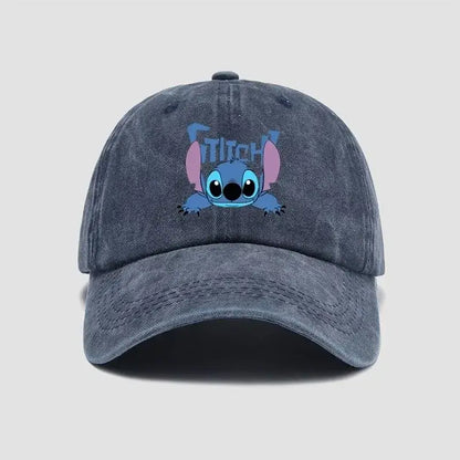 A faded dark blue denim stitch snapback cap featuring a printed cartoon stitch with pink ears and light blue eyes