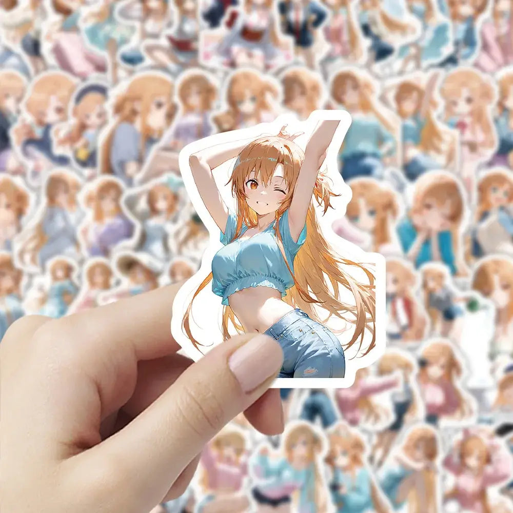 A hand holds a white-bordered sword art online heroine sticker from a waterproof sticker pack featuring anime art