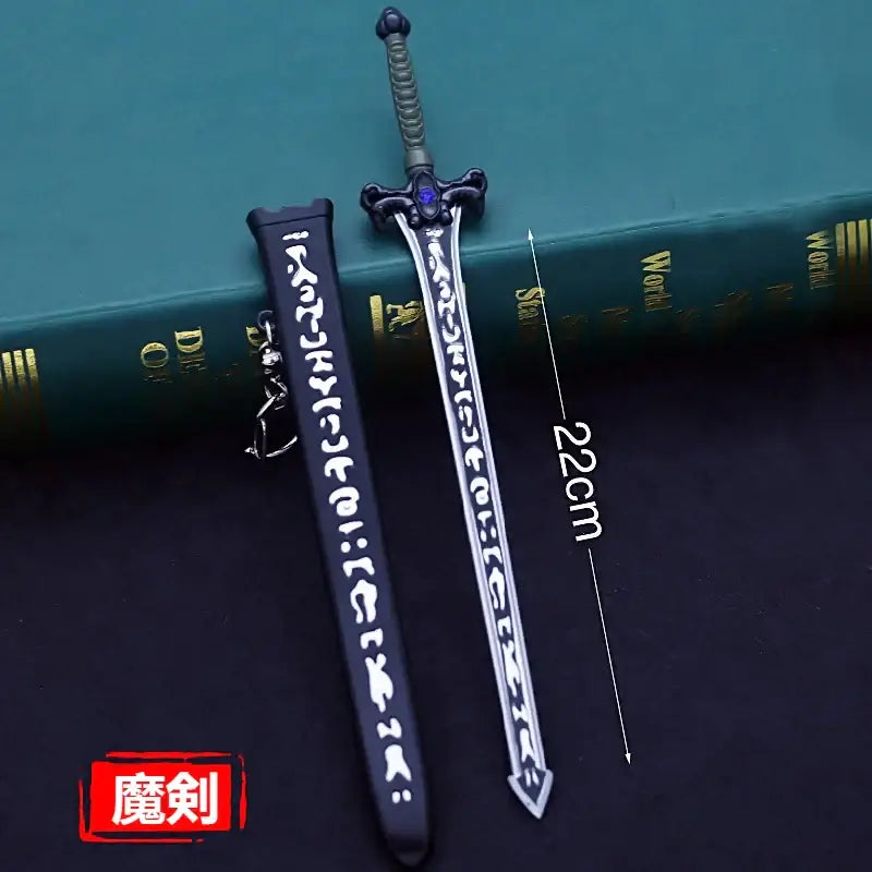 Silver steel kirito elucidator sword keychain with black scabbard white inscriptions and purple gemstone hilt