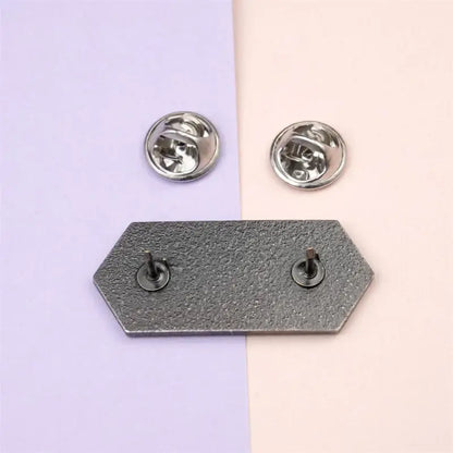 Hexagonal metallic sword art online sao emaille pin with textured gray finish and two silver-toned back clasps
