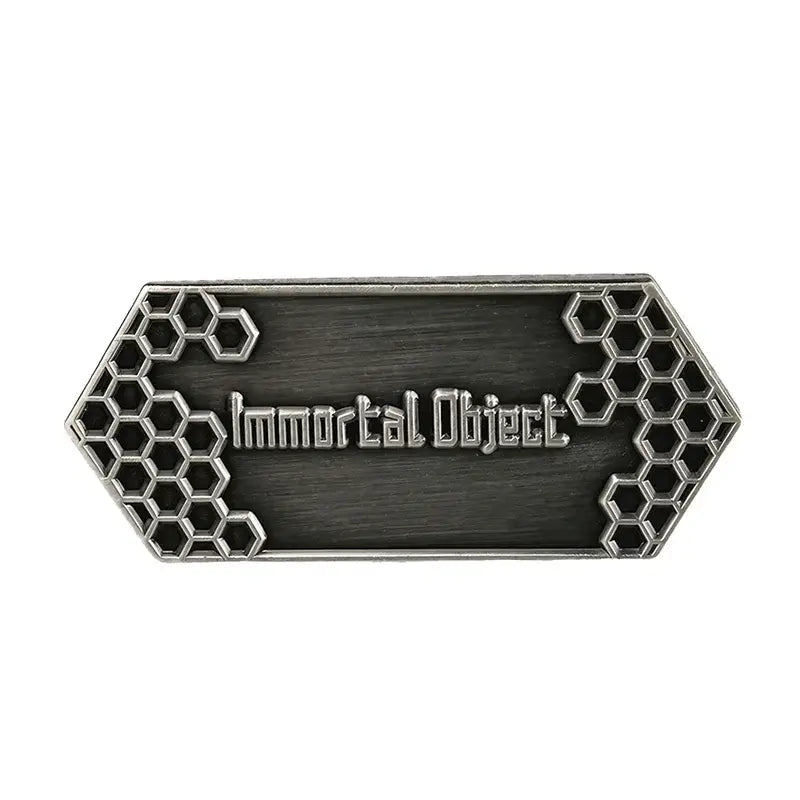 Silver-toned rectangular metal sword art online sao emaille pin with engraved immortal object text and hexagonal lattice patterns