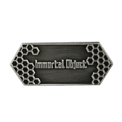 Silver-toned rectangular metal sword art online sao emaille pin with engraved immortal object text and hexagonal lattice patterns