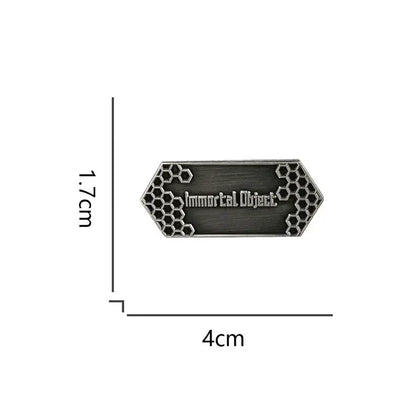 A sleek hexagonal sword art online emaille pin with dark brushed metal and honeycomb patterns for vintage badge fans