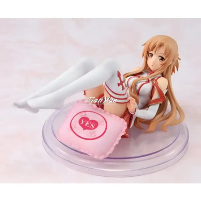 A pink pillow with a red heart and yes embroidered on a clear plastic base from sword art online yuuki asuna pvc figure