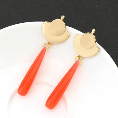 Gold-toned geometric mao mao cosplay earrings with vibrant orange teardrop pendants and alloy green gem accents