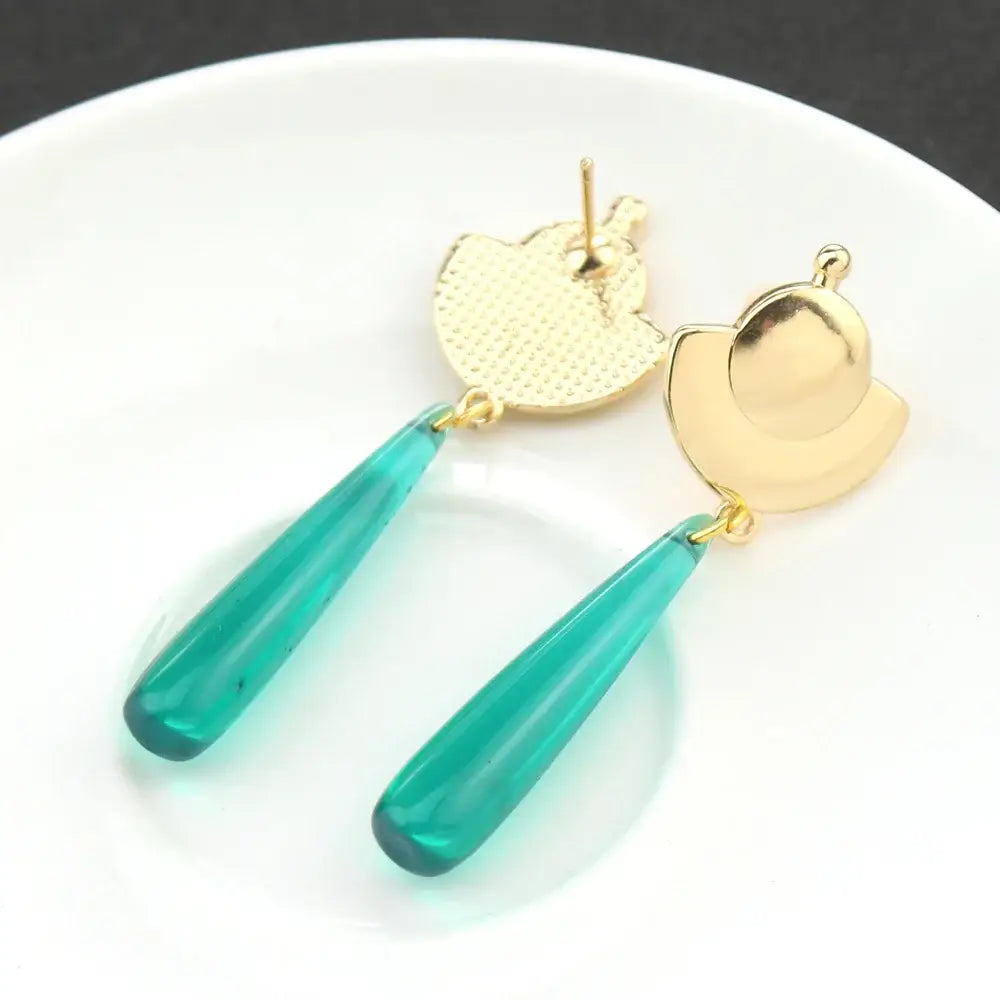 Teal glass teardrop earrings with gold-toned leaf tops featuring mao mao cosplay green gem alloy design