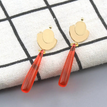 Gold-toned hat-shaped maomao drop earrings with translucent red teardrop pendants from apothecary diaries cosplay jewelry
