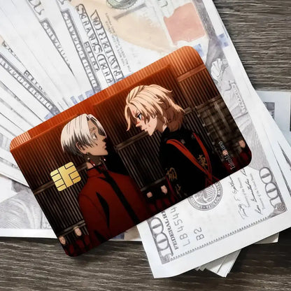 A glossy rectangular credit card sticker featuring two tokyo revengers characters in a dramatic warm-toned design