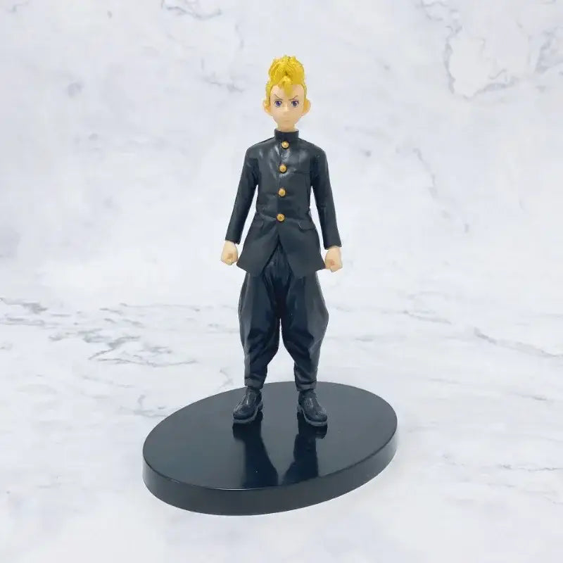 Black plastic figurine of mikey with spiky blonde hair in black uniform with gold buttons tokyo revengers pvc figure