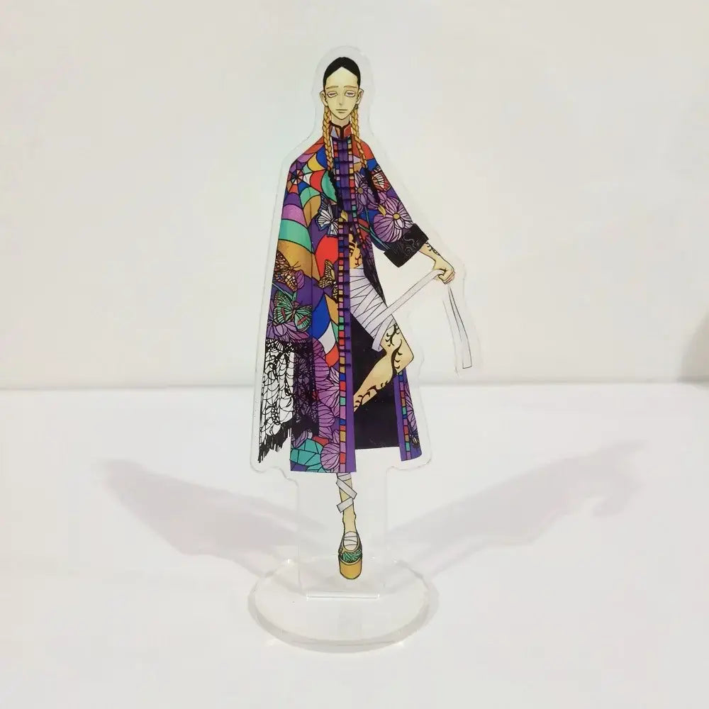 A colorful tokyo revengers ran rindo haitani acrylic stand featuring a vibrant geometric and floral patterned woman in a long coat