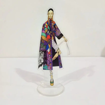 A colorful tokyo revengers ran rindo haitani acrylic stand featuring a vibrant geometric and floral patterned woman in a long coat