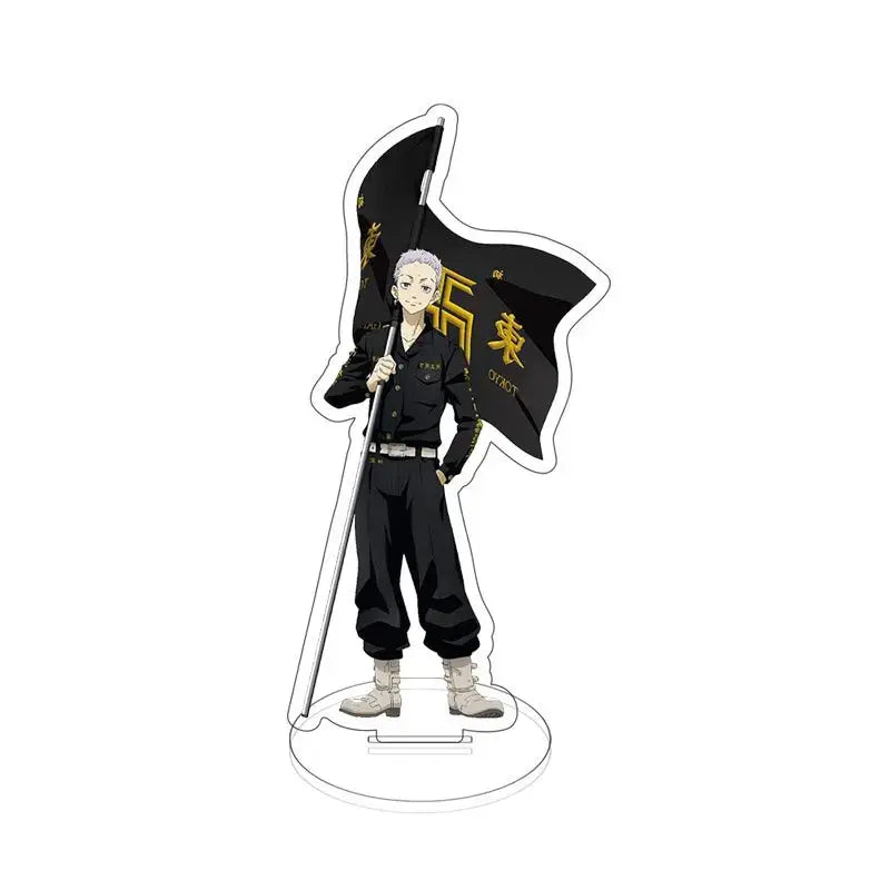 Black acrylic standee of tokyo revengers sano manjiro with silver hair in black uniform holding flag with gold lettering