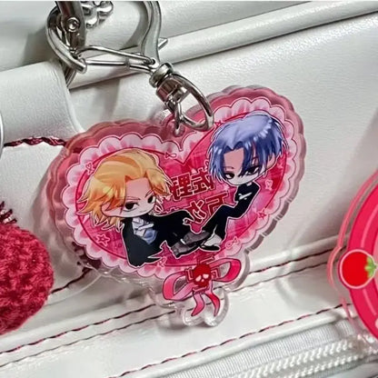 Pink heart-shaped acrylic keychain featuring two tokyo revengers anime characters in black suits with decorative lace details
