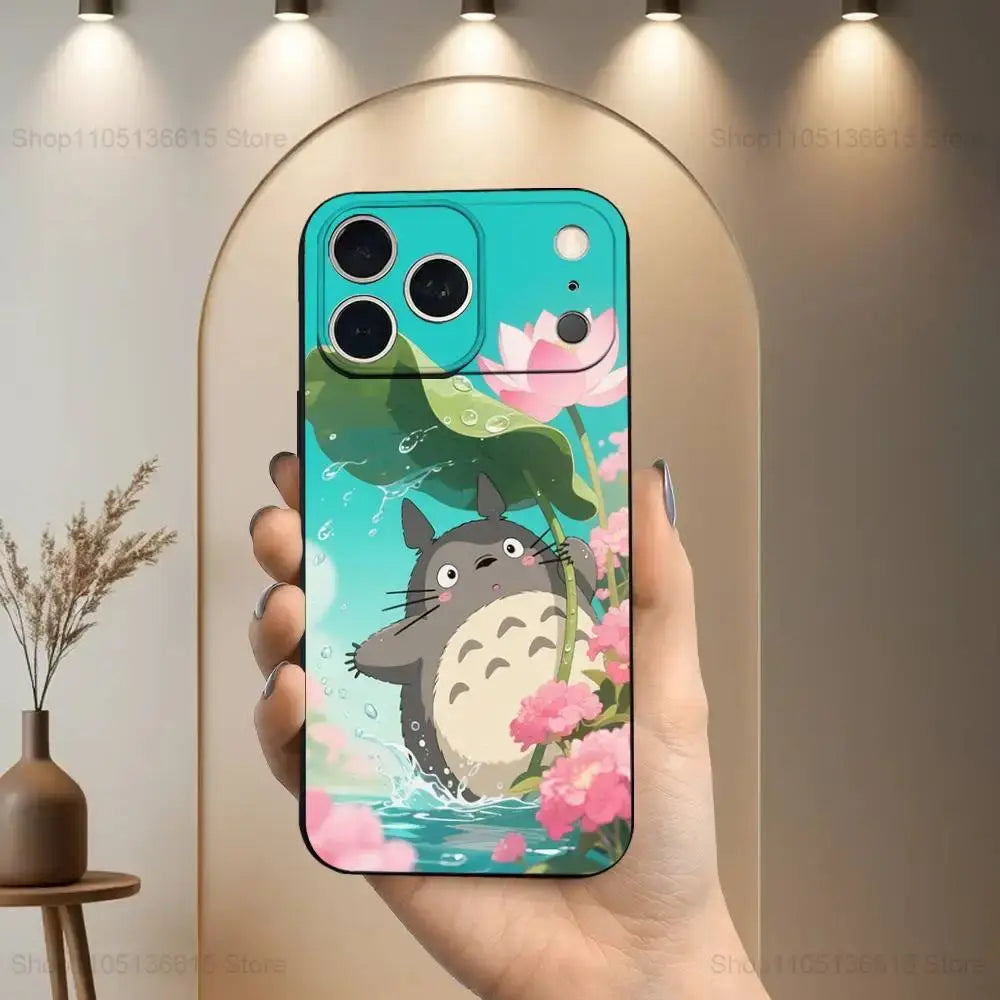 Back side of a vibrant turquoise soft silicone phone case featuring cartoon totoro with pink lotus flowers and green lily pads