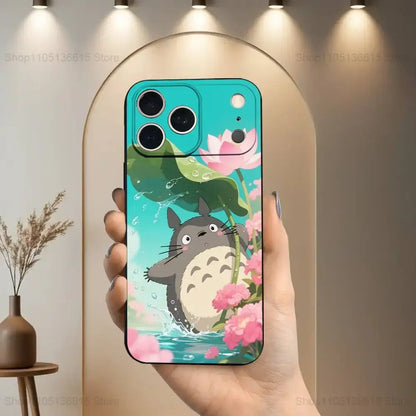 Back side of a vibrant turquoise soft silicone phone case featuring cartoon totoro with pink lotus flowers and green lily pads