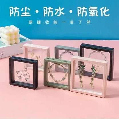 Set of six square acrylic jewelry display boxes in black white and sage green frames for valorant clove ring set