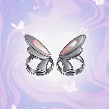 A pair of silver adjustable butterfly rings with iridescent pink and white wings valorant clove ring set cosplay accessory
