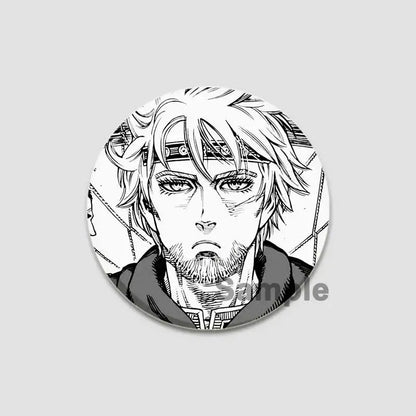 Circular black-and-white anime badge pin featuring detailed line art of bearded man with spiky hair on tinplate plastic