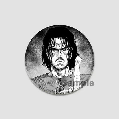 Vinland saga anime badge pin featuring a black and white tinplate button with a detailed stern anime character illustration