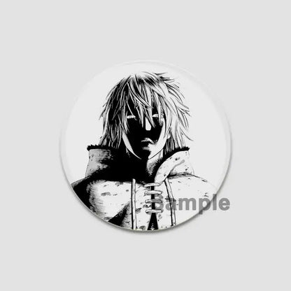 Black-and-white vinyl saga anime badge pin featuring a spiky-haired character in a hooded garment on tinplate plastic
