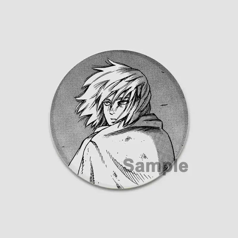 Circular black-and-white vinyl saga anime badge pin featuring manga-style spiky hair character with intense gaze