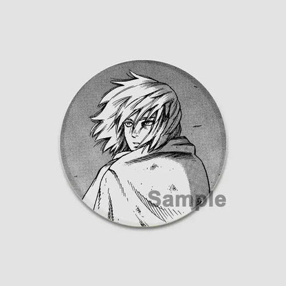Circular black-and-white vinyl saga anime badge pin featuring manga-style spiky hair character with intense gaze