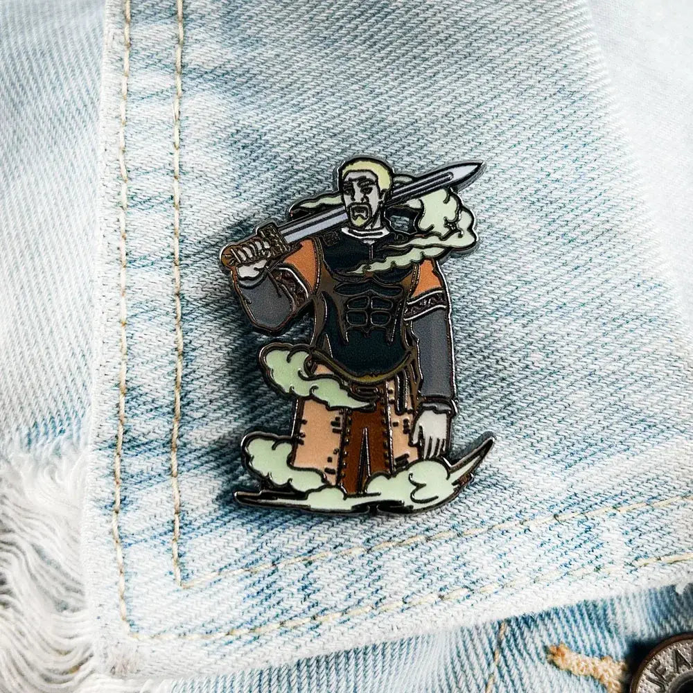 Vinland saga askeladd lapel pin enamel badge featuring a warrior with blonde hair in black and orange armor on clouds