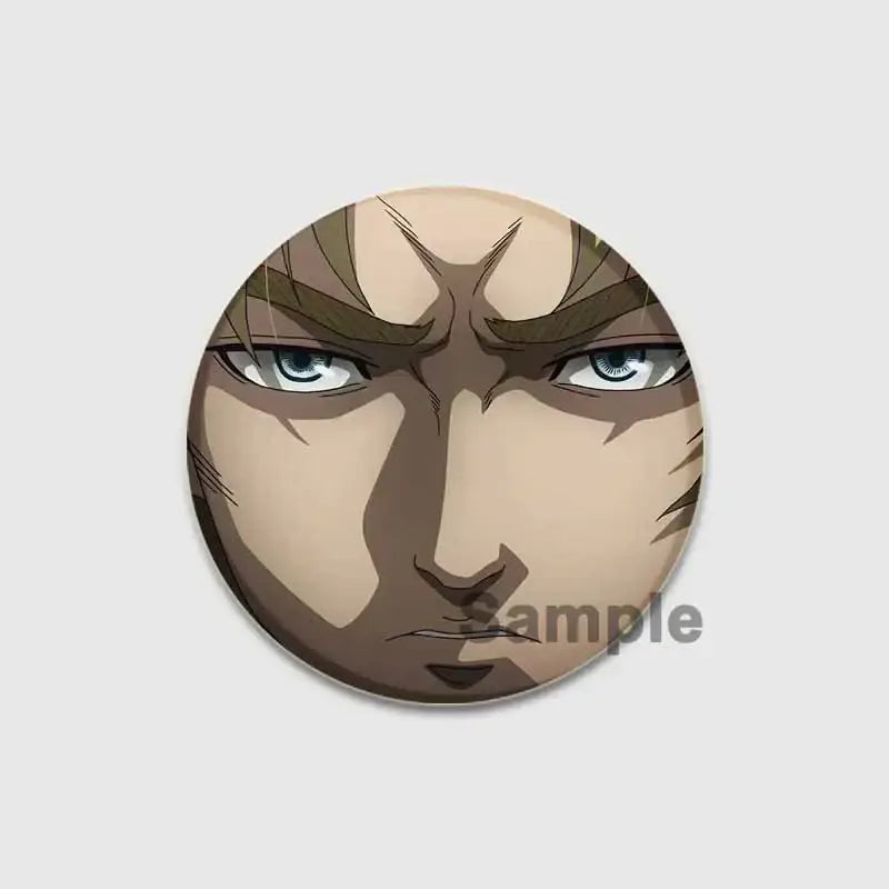 Circular vinland saga badge pin featuring an intense anime face with blue eyes on a handmade tinplate brooch