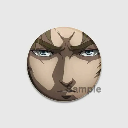 Circular vinland saga badge pin featuring an intense anime face with blue eyes on a handmade tinplate brooch