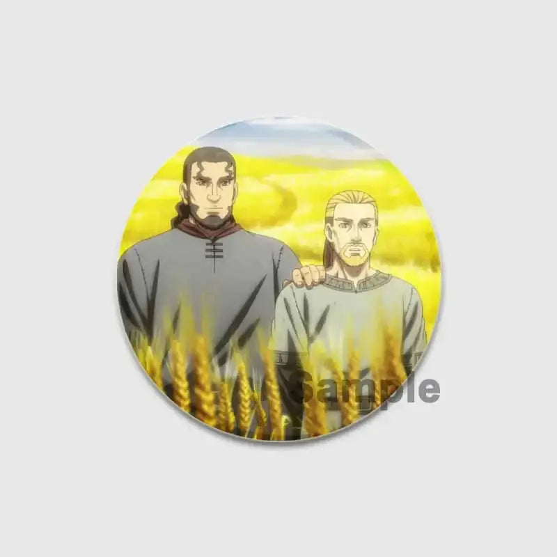 Circular vinland saga badge pin featuring two animated characters in a golden wheat field on handmade tinplate