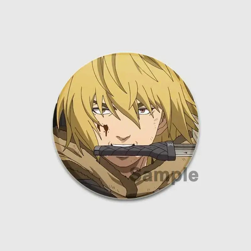 Circular handmade tinplate vinland saga badge pin featuring blonde anime character holding sword across mouth