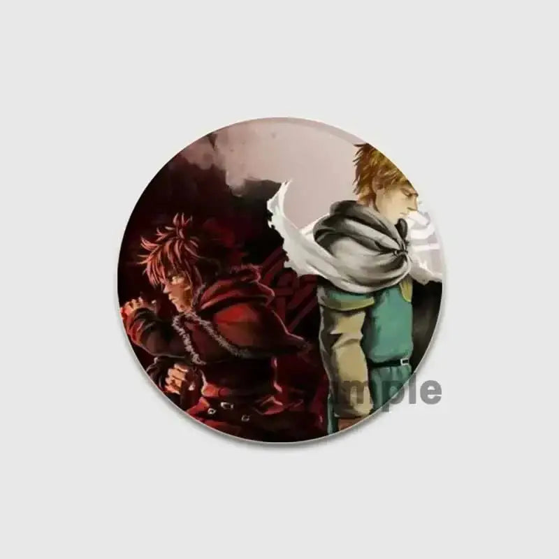 Circular vinland saga badge pin featuring anime illustration of two characters in red and green outfits on tinplate brooch