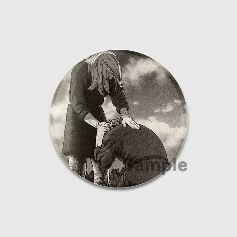 Circular black-and-white vinland saga badge pin featuring two anime figures in a dramatic pose on tinplate brooch