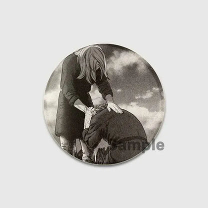 Circular black-and-white vinland saga badge pin featuring two anime figures in a dramatic pose on tinplate brooch