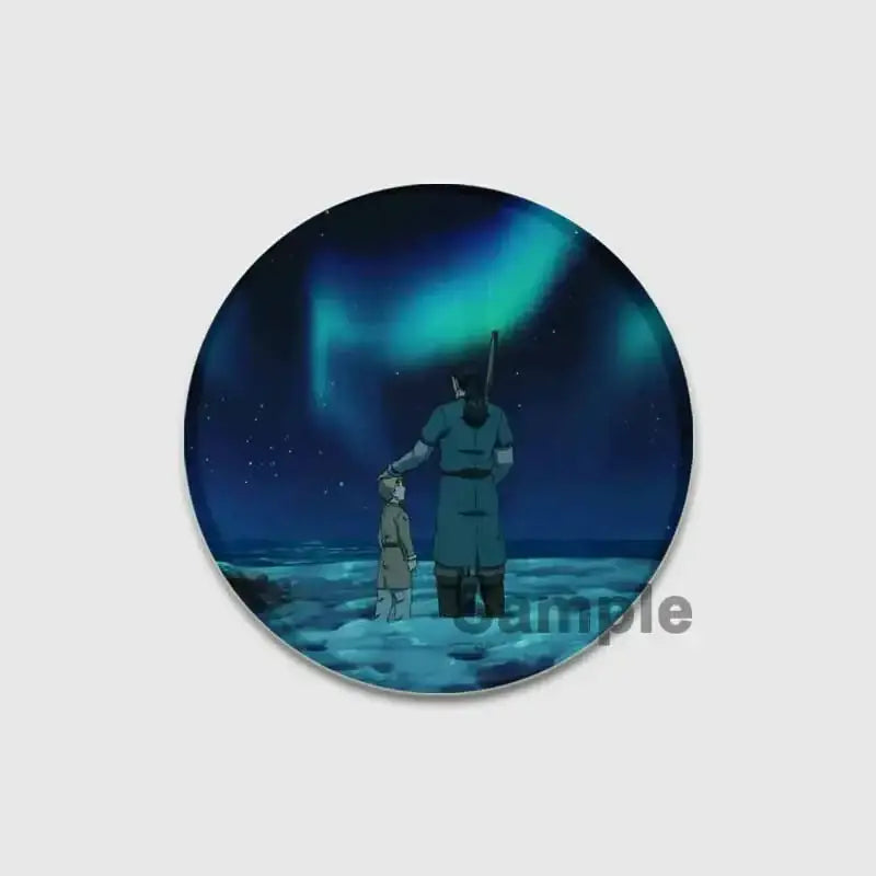 Circular acrylic vinland saga badge pin showing a tall figure and child on icy terrain under green aurora