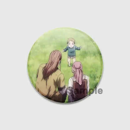 Vinland saga badge pin featuring a handmade tinplate circular button with an anime baby in green on grass and adults behind